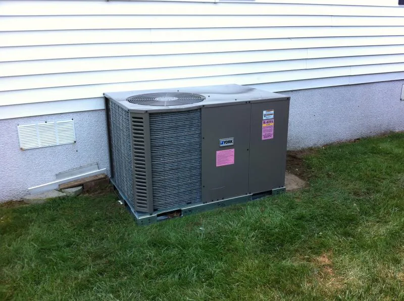 York central air conditioning condenser installed outside a home